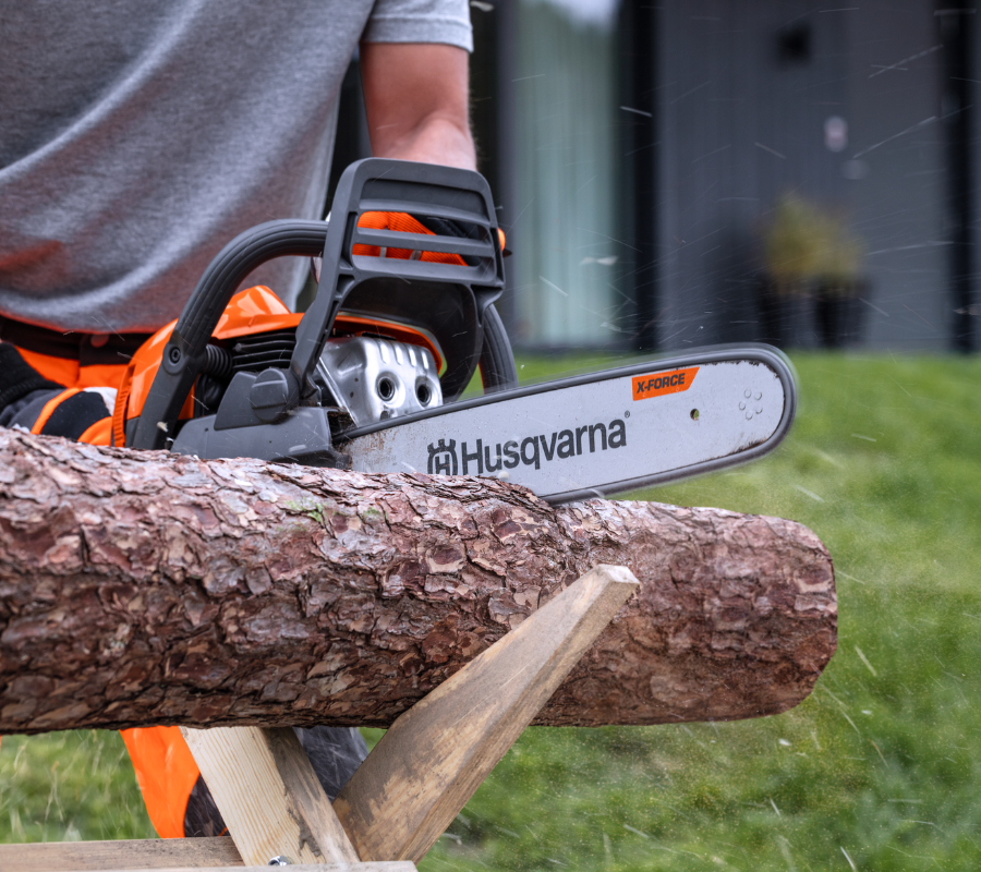 chopping wood with chainsaw
